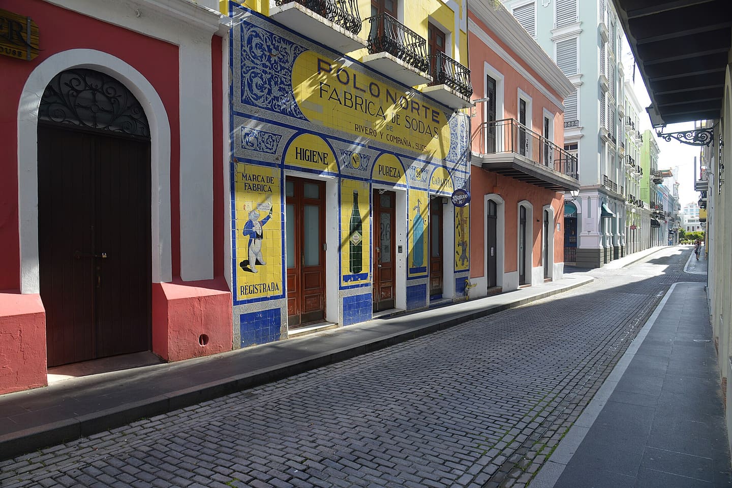 The hand-painted blue and yellow tile facade of Polo Norte on Calle Tetuán in Old San Juan
